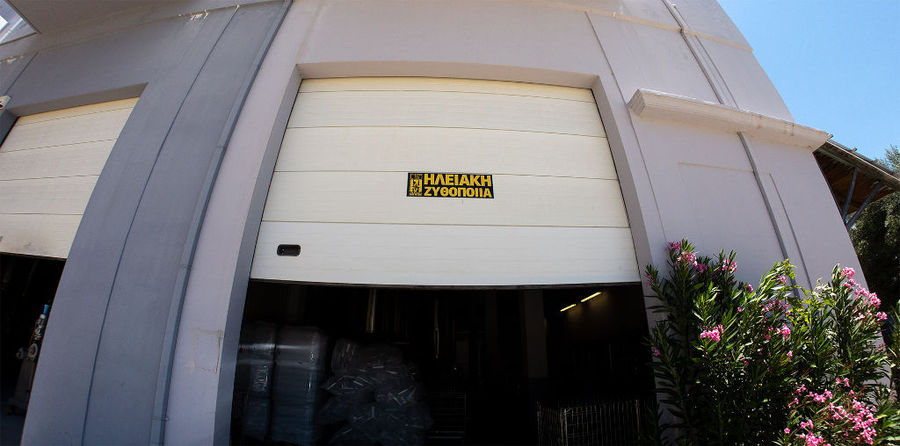 Front view of building of Elis Brewery with a pancard with their logo company at left